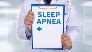 doctor holding sleep apnea chart
